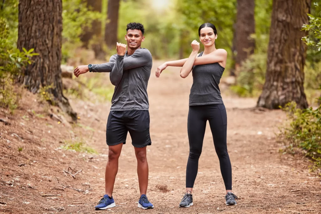 portrait of a happy young male and female athlete utc